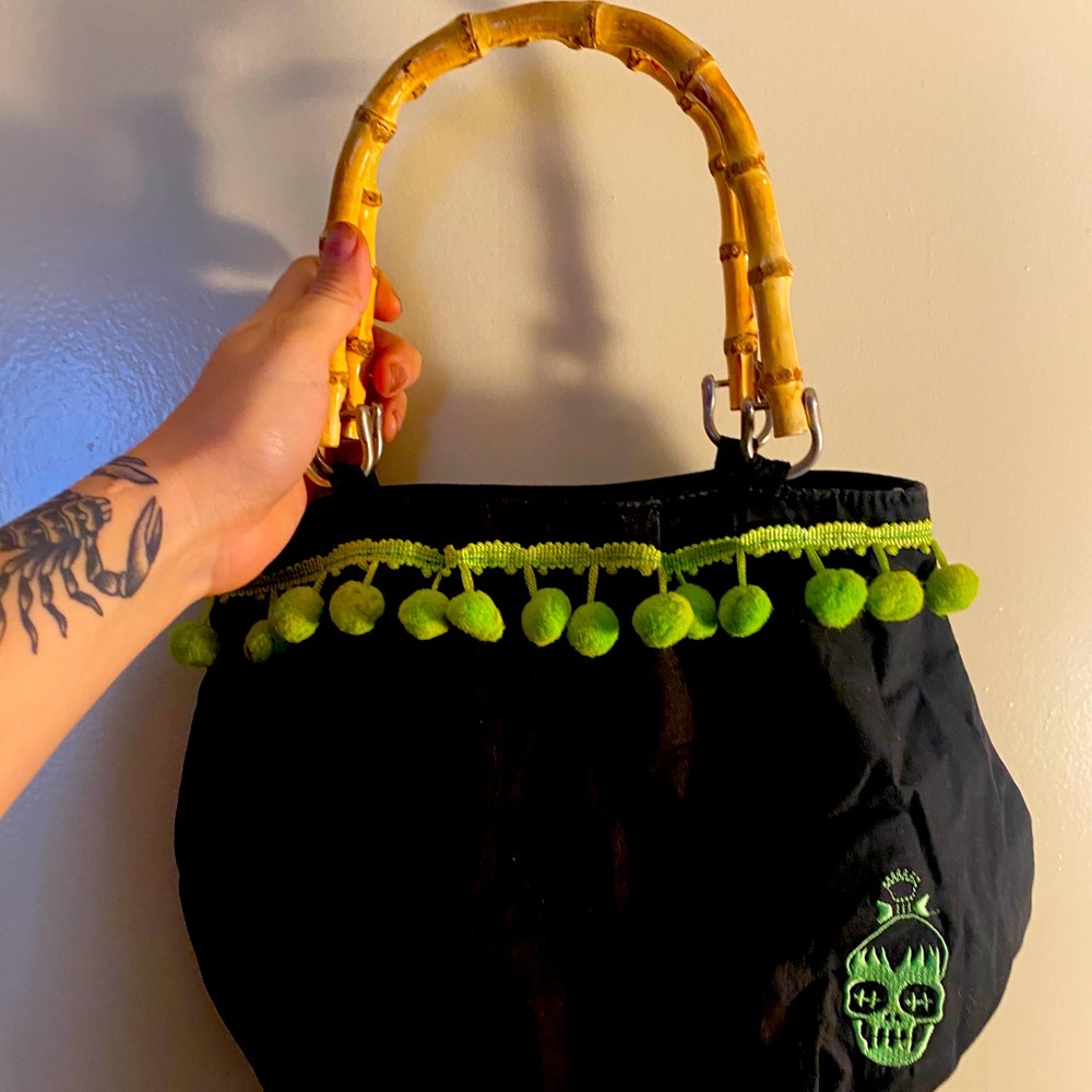 Sour puss shrunken head purse